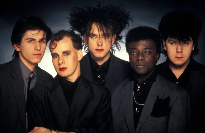 The Cure in 1984, with Andy Anderson second from right.