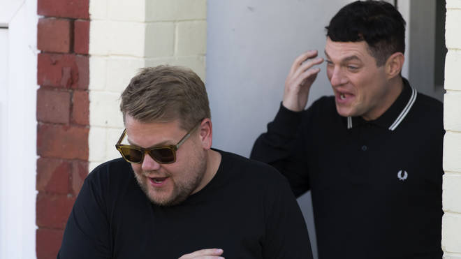 James Corden (L), who plays Smithy, is seen with Matthew Horne, who plays Gavin Shipman, during filming for the Gavin and Stacey Christmas special on Trinity Street on July 12, 2019 in Barry, Wales.