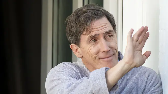 Rob Brydon, who plays Bryn West, is seen waving during filming for the Gavin and Stacey Christmas special on Trinity Street on July 12, 2019 in Barry, Wales.