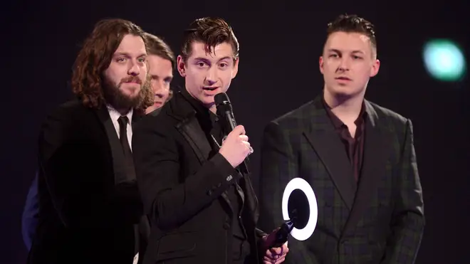Alex Turner, Nick O'Malley, Jaime Cook and Matt Helders of Arctic Monkeys receive the award for the MasterCard British Album of the Year at The BRIT Awards 2014