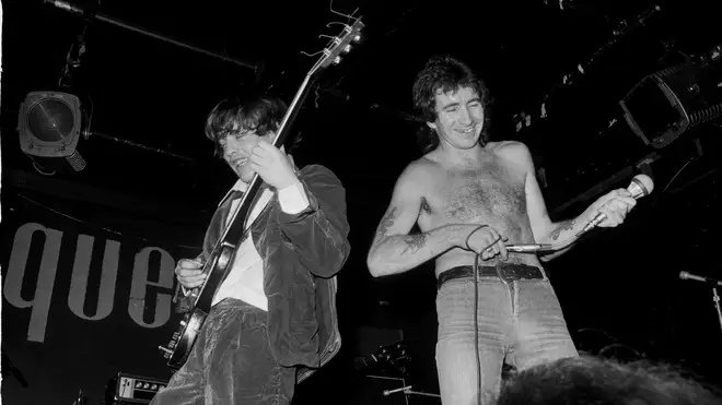 Angus Young and Bon Scott of AC/DC perform at the second Marquee, July 1976