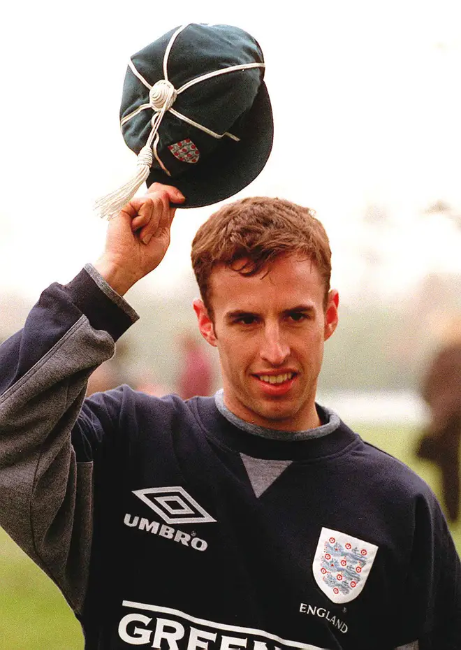 Aston Villa's Gareth Southgate holds up his first cap for England in 1996