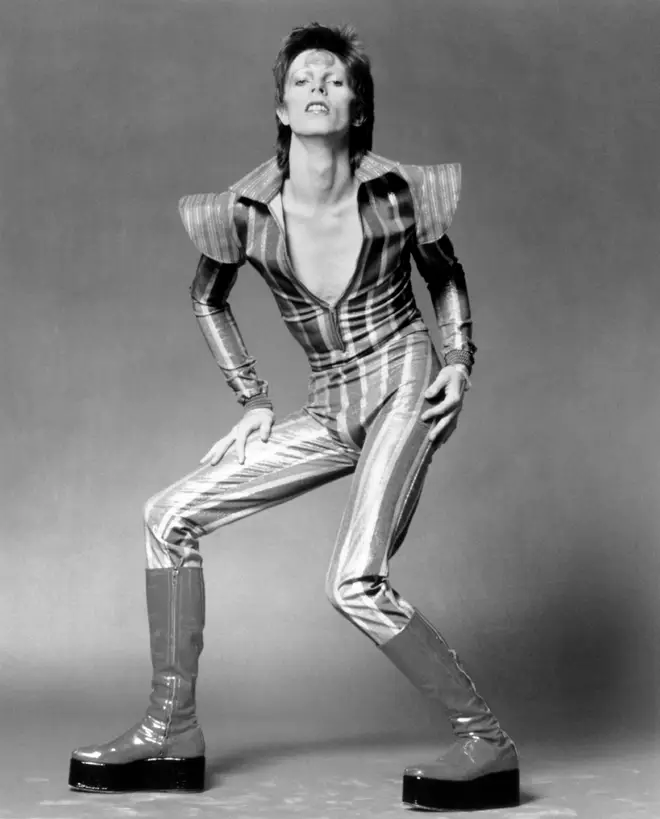 David Bowie wearing the classic glam rock stacked boots in June 1972