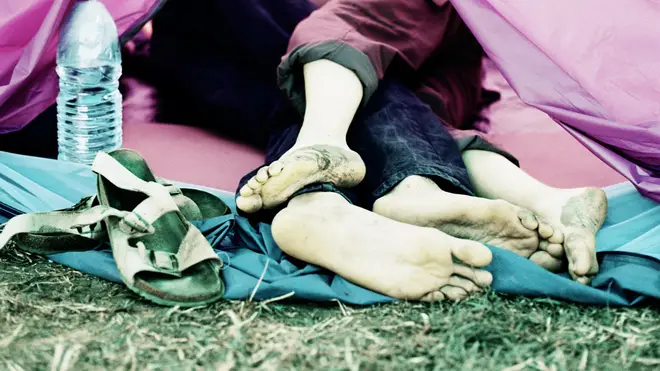 Couple kissing in tent at Glastonbury Festival
