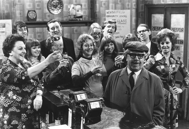 Some of the cast of the British television soap opera, 'Coronation Street' in the bar of the show's pub, 1978