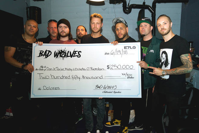 Bad Wolves present The Cranberries singer Dolores O'Riordan's family with a cheque for £250,000.