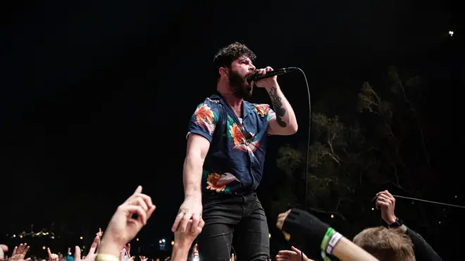 Yannis Philippakis of Foals performs in the crowd on the Amphitheatre stage during Splendour In The Grass 2019 on July 19, 2019