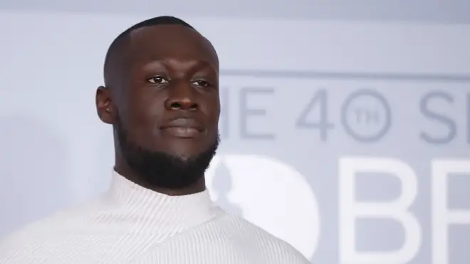 Stormzy poses on the red carpet on arrival for the BRIT Awards 2020 in London