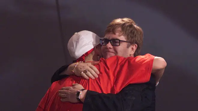 Eminem hugging Elton John at the 2001 BRIT Awards