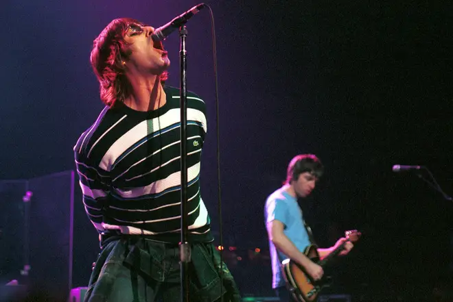 ; Liam Gallagher and Noel Gallagher performing live onstage at Ancienne Belgique, March 2000
