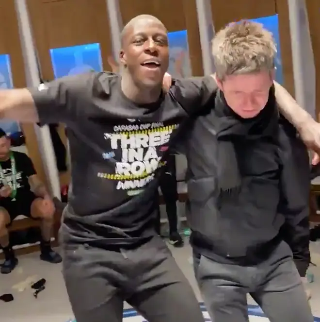 Man City's Benjamin Mendy with Noel Gallagher in the Man City dressing room following their 2-1 Victory against Aston Villa