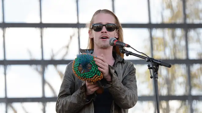 Macaulay Culkin of The Pizza Underground performs on stage at Riot Fest Chicago 2014