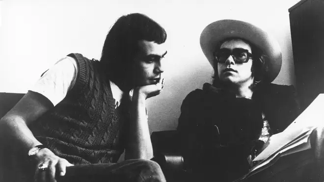 Elton John and his lyricist Bernie Taupin pose for a portrait in circa 1973