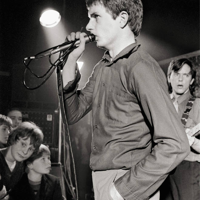 Ian Curtis thinking about what time he needs to be back at his desk tomorrow morning during Joy Division's set at Bowdon Vale Youth Club on 14 March 1979.