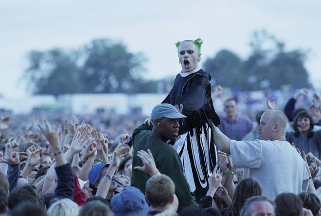 The much-missed  Keith Flint leaves the stage to crowd-surf over the audience during the group's support slot for Oasis at Knebworth on 10 August 1996.