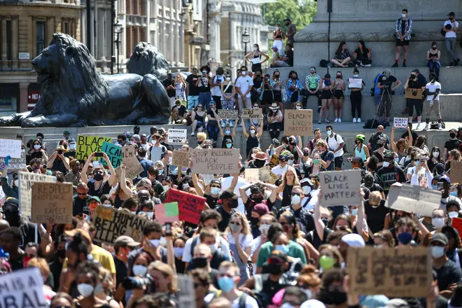 People hold placards as they join a spontaneous Black Lives Matter march at Trafalgar Square to protest the death of George Floyd in Minneapolis , 31 May 2020.