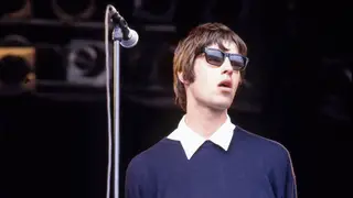Liam Gallagher onstage with Oasis at Glastonbury in 1994