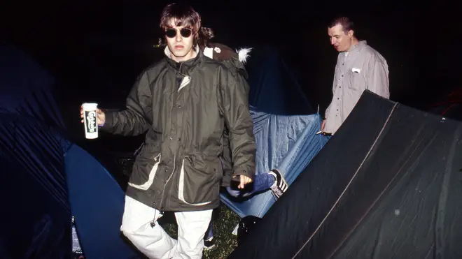 It doesn't matter if your band is headlining the Pyramid Stage, you still have to navigate those guy ropes. Liam Gallagher at Glastonbury 1995