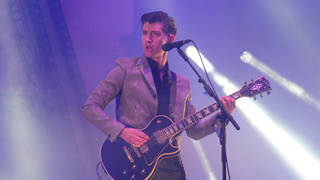 Alex Turner on stage as Arctic Monkeys headline Glastonbury Festival 2013