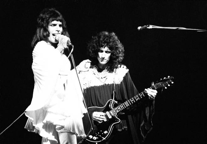 Freddie Mercury and Brian May of Queen perform on stage in London, 1974.