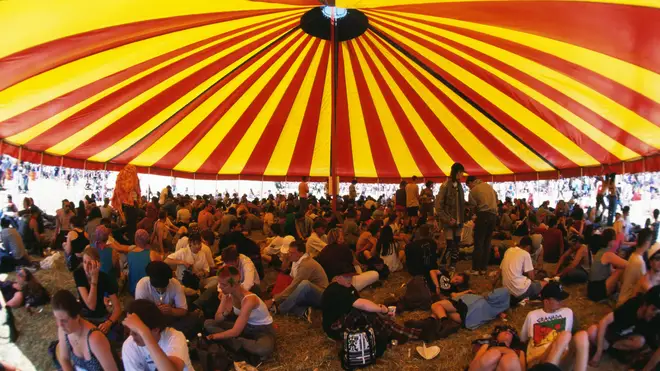 Sheltering under the sun beneath a marquee at Glastonbury 1995.