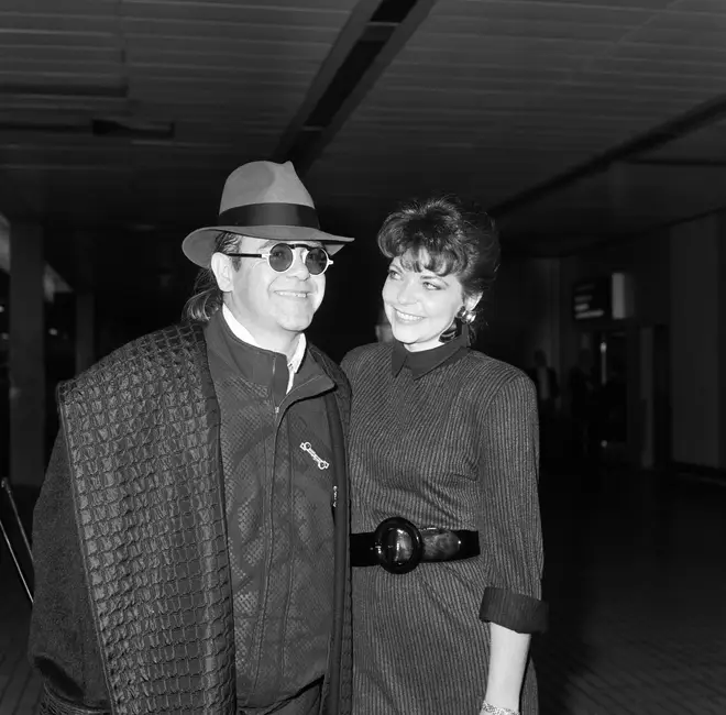 Elton John with his wife Renate arriving from Los Angeles at London Airport, 17th October 1986