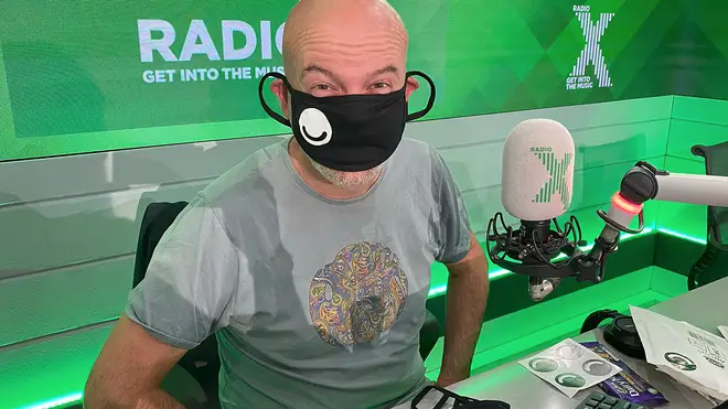 Dominic Byrne  tries on a mask made by a listener on The Chris Moyles Show