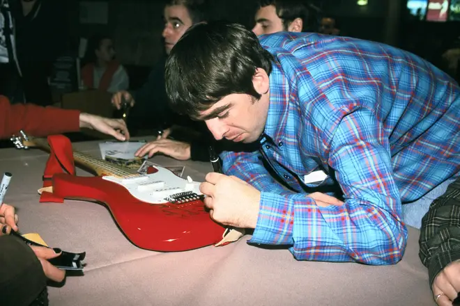 Oasis guitarist Noel Gallagher at a record signing at a Virgin Megastore in Paris