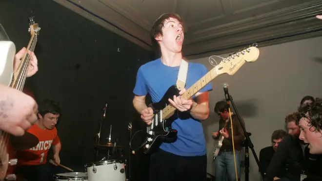 Alex Turner and the black Fender Stratocaster onstage with Arctic Monkeys in Nottingham in 2005 (