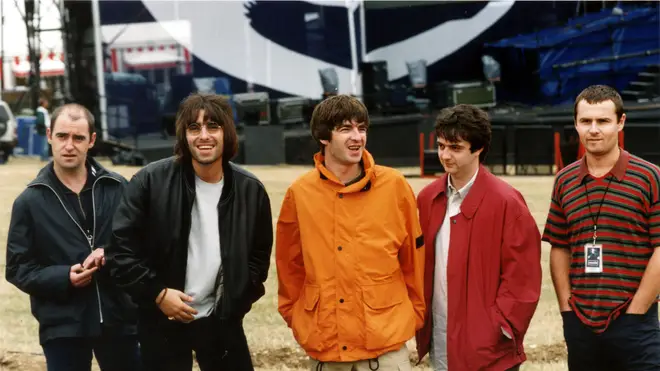 Oasis pose before their 1996 Knebworth gig