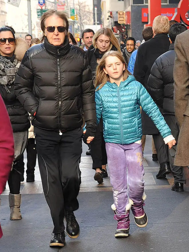 Sir Paul McCartney and his daughter, Beatrice McCartney, are seen on December 19, 2013 in New York City.