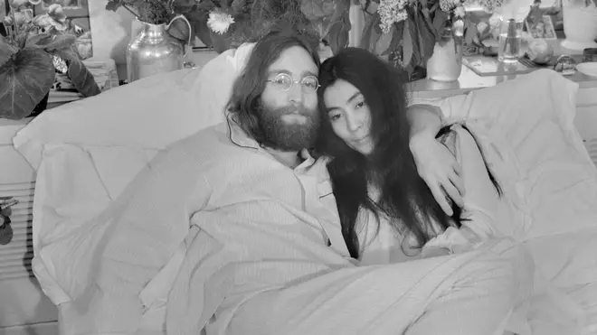 John Lennon and Yoko Ono pose in bed in 1969