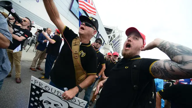 Members of the Proud Boys face off against anti-Trump protesters in 2019