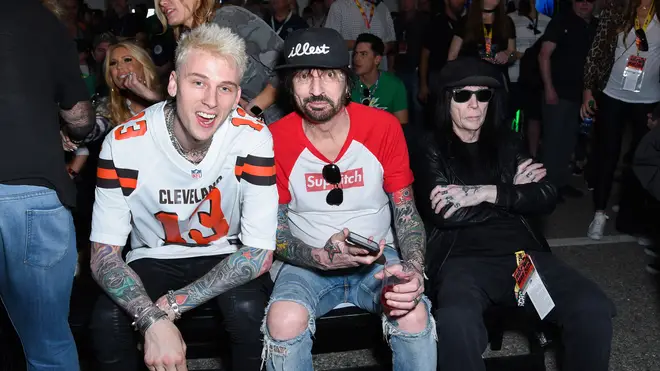 Machine Gun Kelly, Tommy Lee and Mick Mars attend the Monster Energy NASCAR Cup Series race at Auto Club Speedway at Auto Club Speedway on March 17, 2019