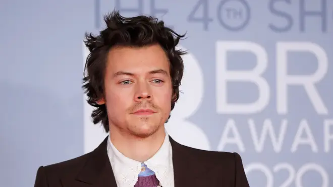 Harry Styles poses on the red carpet on arrival for the BRIT Awards 2020