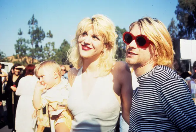 Courtney Love and Kurt Cobain with their daughter Frances Bean in September 1993