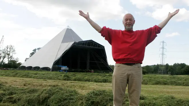 Michael Eavis and the iconic Pyramid Stage at the Glastonbury Festival site in 2005