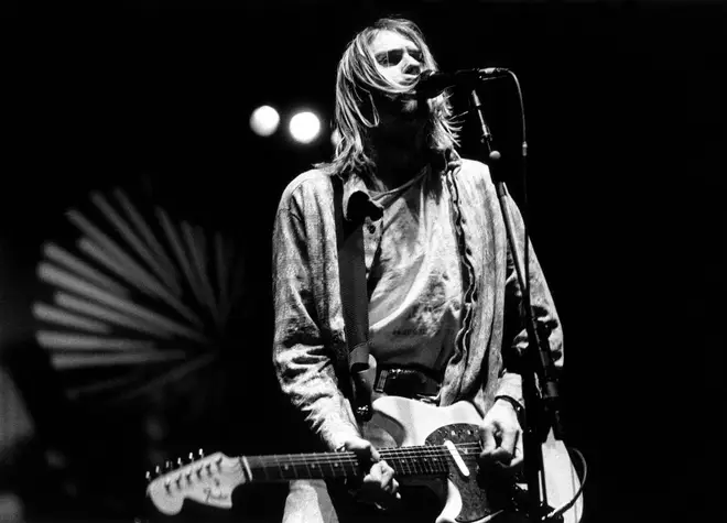 Kurt Cobain performing live onstage with Nirvana at Palasport, Modena on 21 February 1994