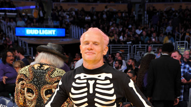 Flea of Red Hot Chili Peppers attends a basketball game dressed as a skeleton between the Los Angeles Lakers and the Dallas Mavericks at Staples Center on October 31, 2018