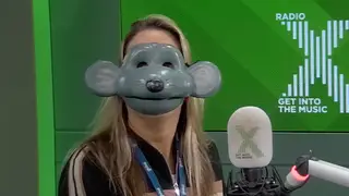 Pippa Taylor wearing a Roland Rat mask on The Chris Moyles Show