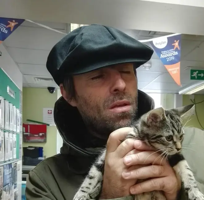 Liam Gallagher poses with pet kitten Sid who he rehomed from Wood Green, The Animals Charity