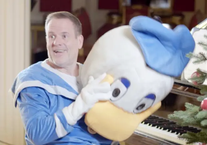 Chris Moyles is dressed as Donald Duck as he's reveals himself as the prankster behind the 'leaked' fake John Lewis Christmas ad