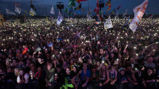 Fans face the Pyramid Stage at Glastonbury Festival 2017