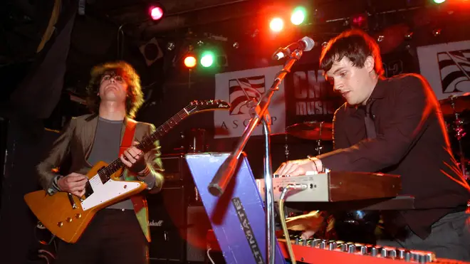 Dave Keuning and Brandon Flowers performing with The Killers at the CMJ Music Marathon October 2003