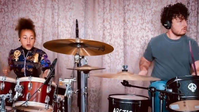 Nandi Bushell and Matt Helders drum to Arctic Monkeys Brianstorm