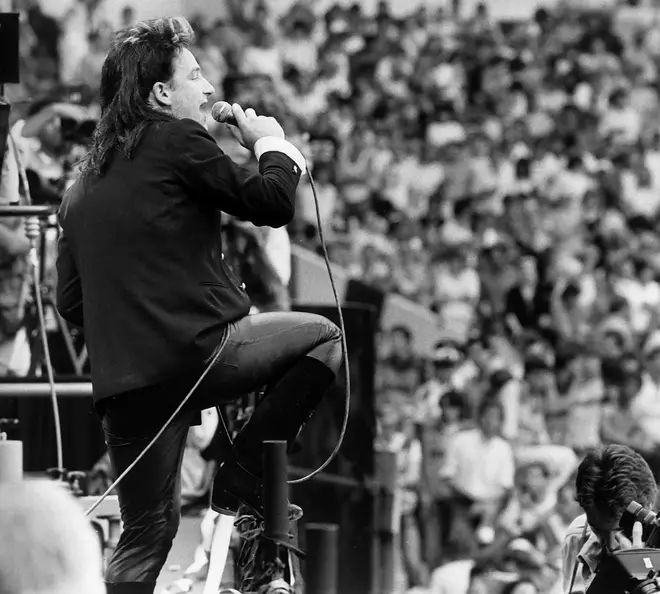 Bono performs with U2 at Live Aid