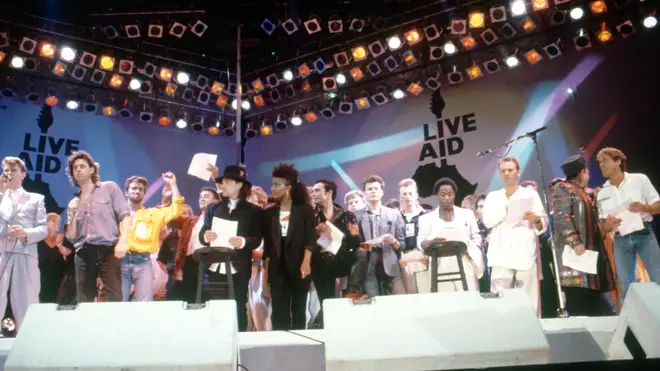 Musicians gather on stage during the Live Aid concert held in London