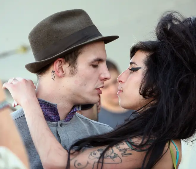 Amy Winehouse kisses fiance Blake Fielder-Civil during the Coachella festival 2007