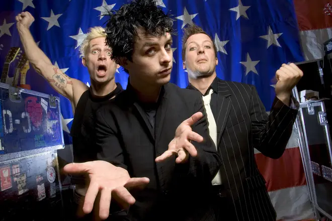 Green Day launch American Idiot in September 2004: Mike Dirnt, Billy Joe Armstrong, and Tre Cool.