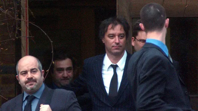 Peter Buck arrives at court, 2002